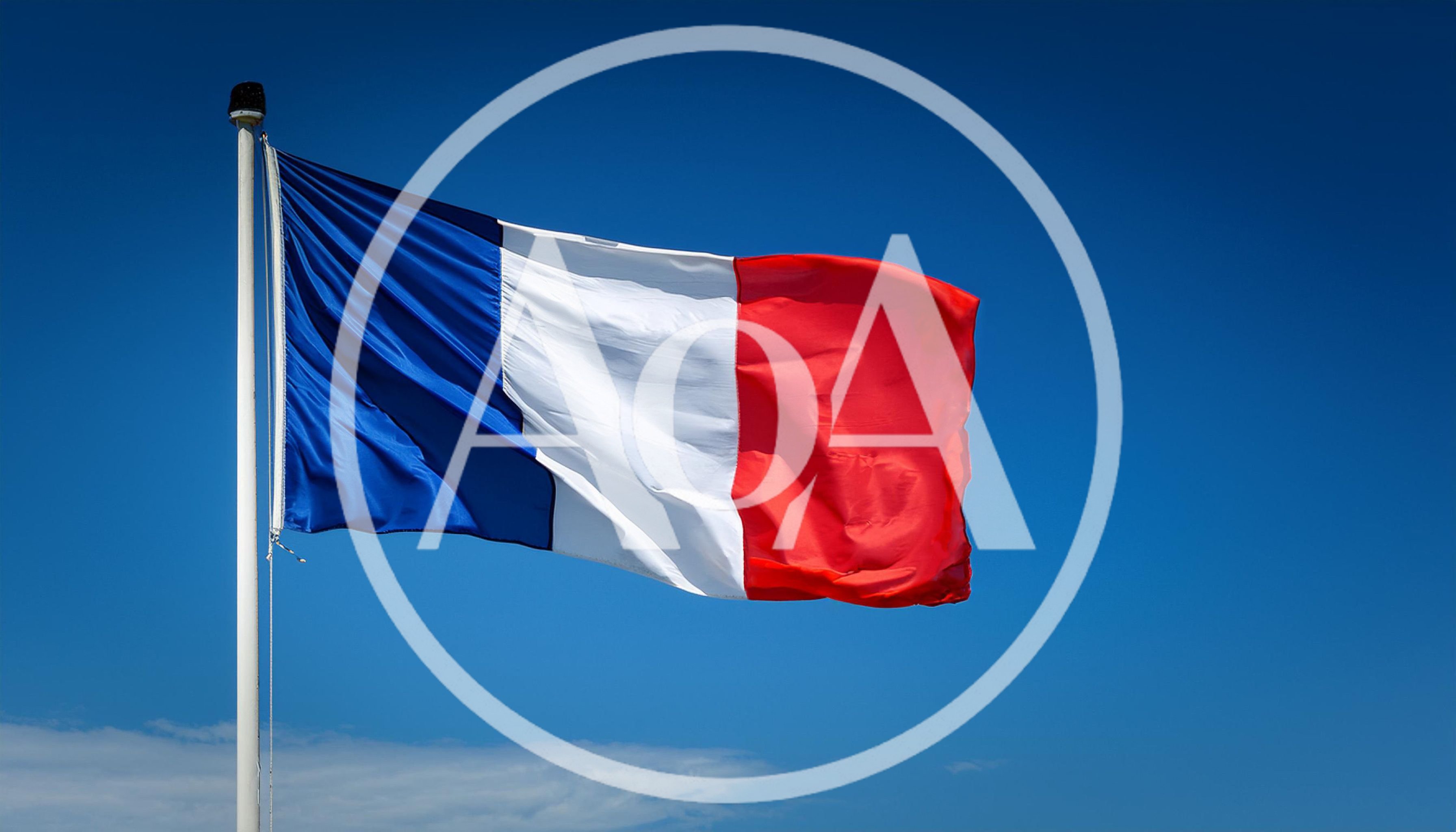 French Flag Waving Against A Clear Blue Sky