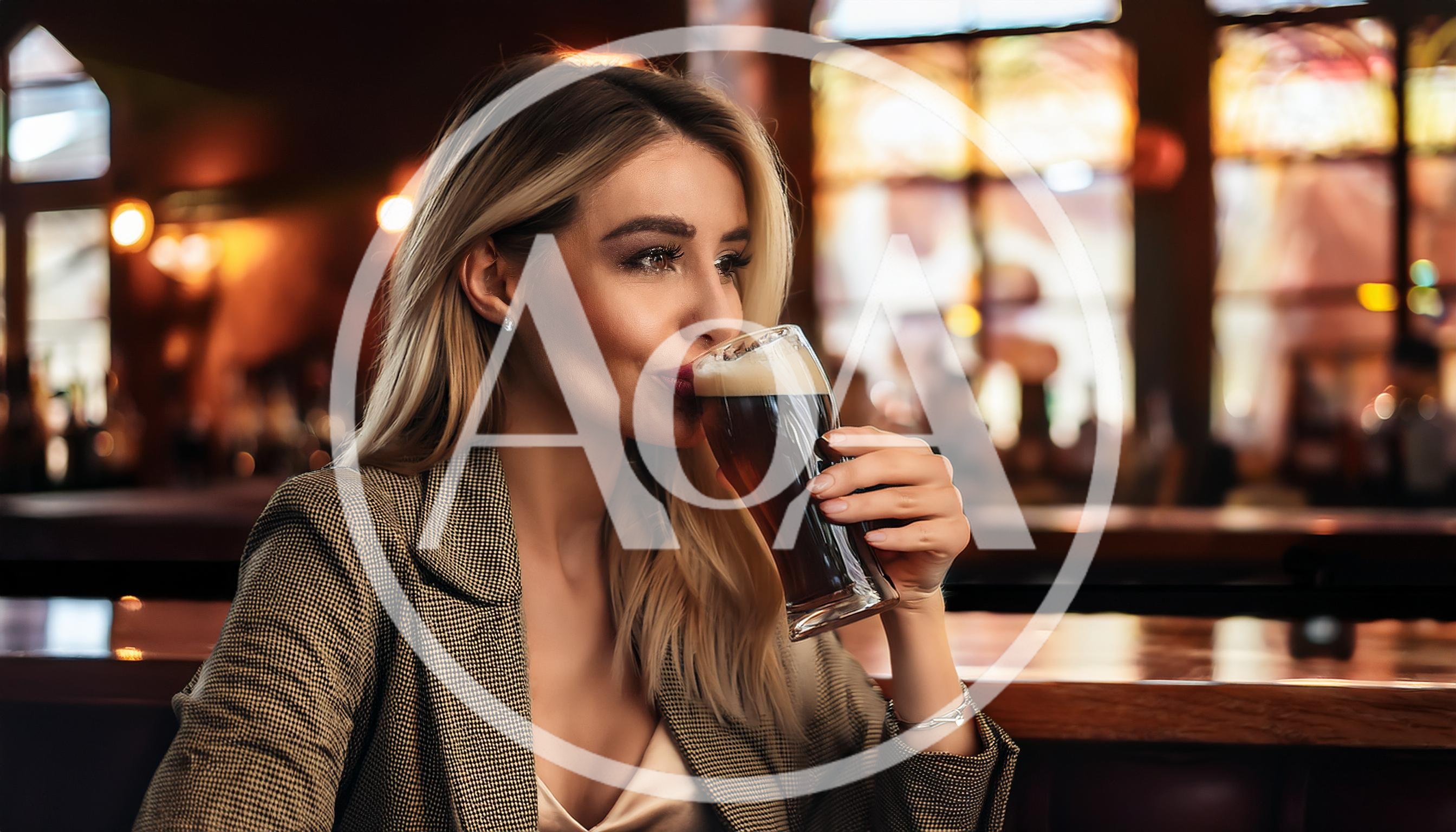 Elegant Woman Drinking Dark Beer at a Pub