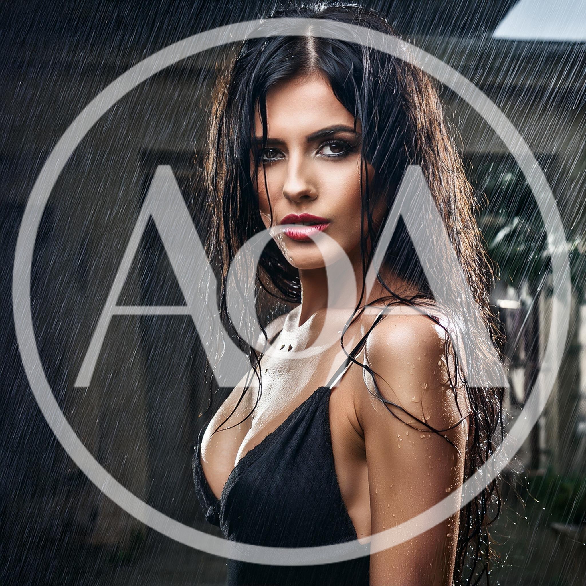 Sensual Woman Standing Under Heavy Rain Outdoors