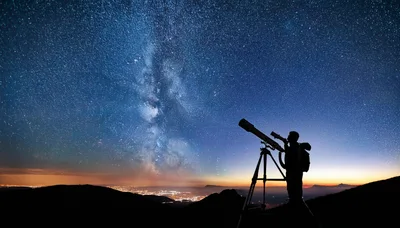 Astronomer Observing The Milky Way With A Telescope