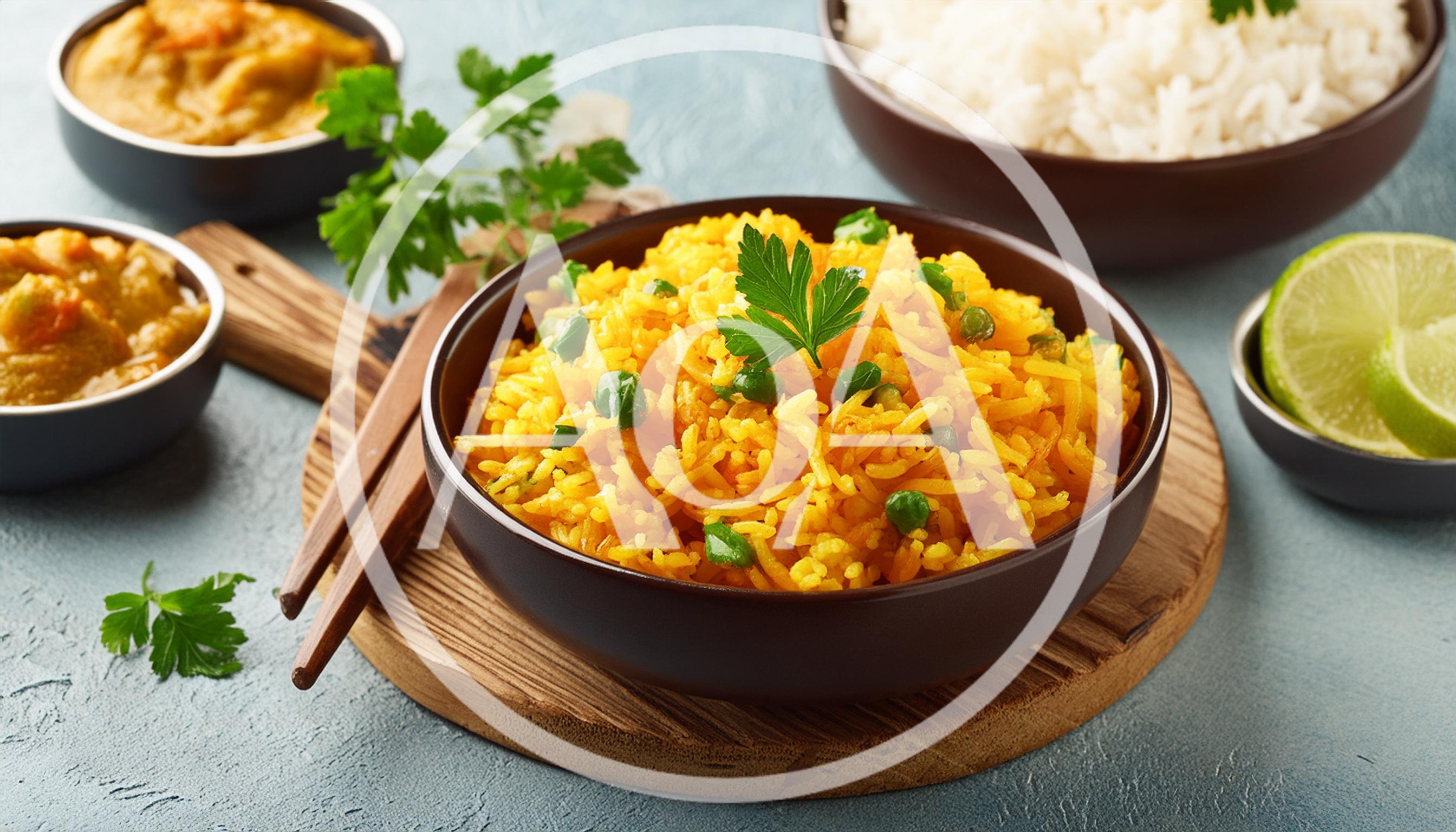Bowl Of Yellow Turmeric Rice With Peas