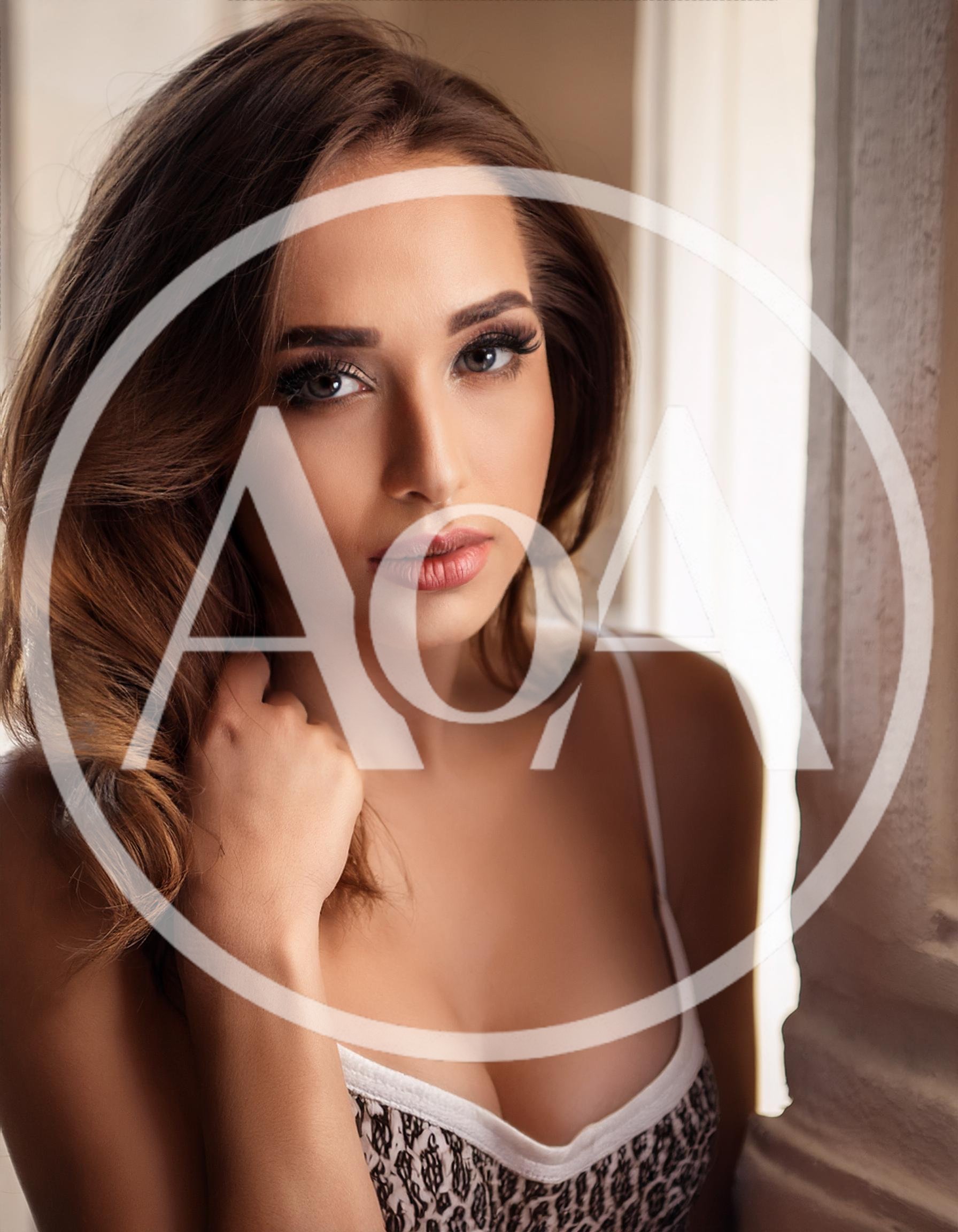 Portrait Of A Beautiful Young Woman With Wavy Hair
