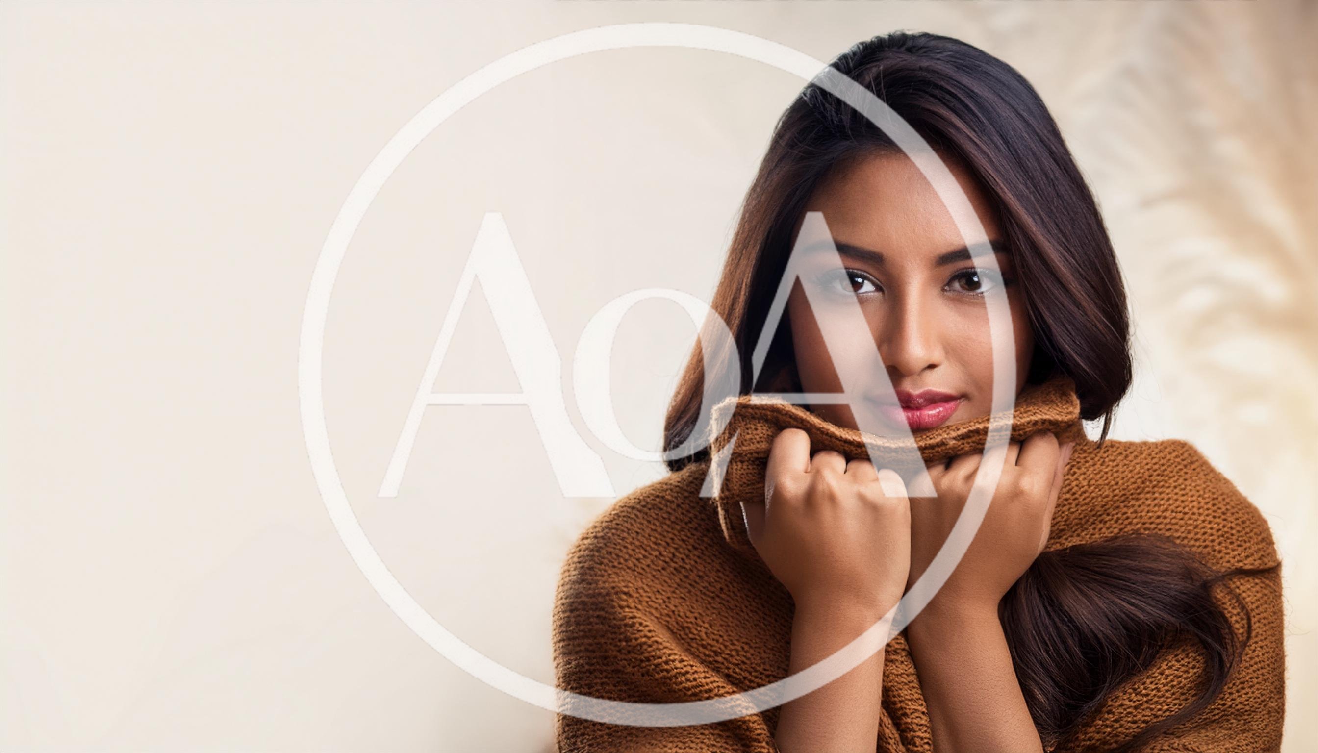 Young Woman Wearing A Cozy Brown Knitted Sweater