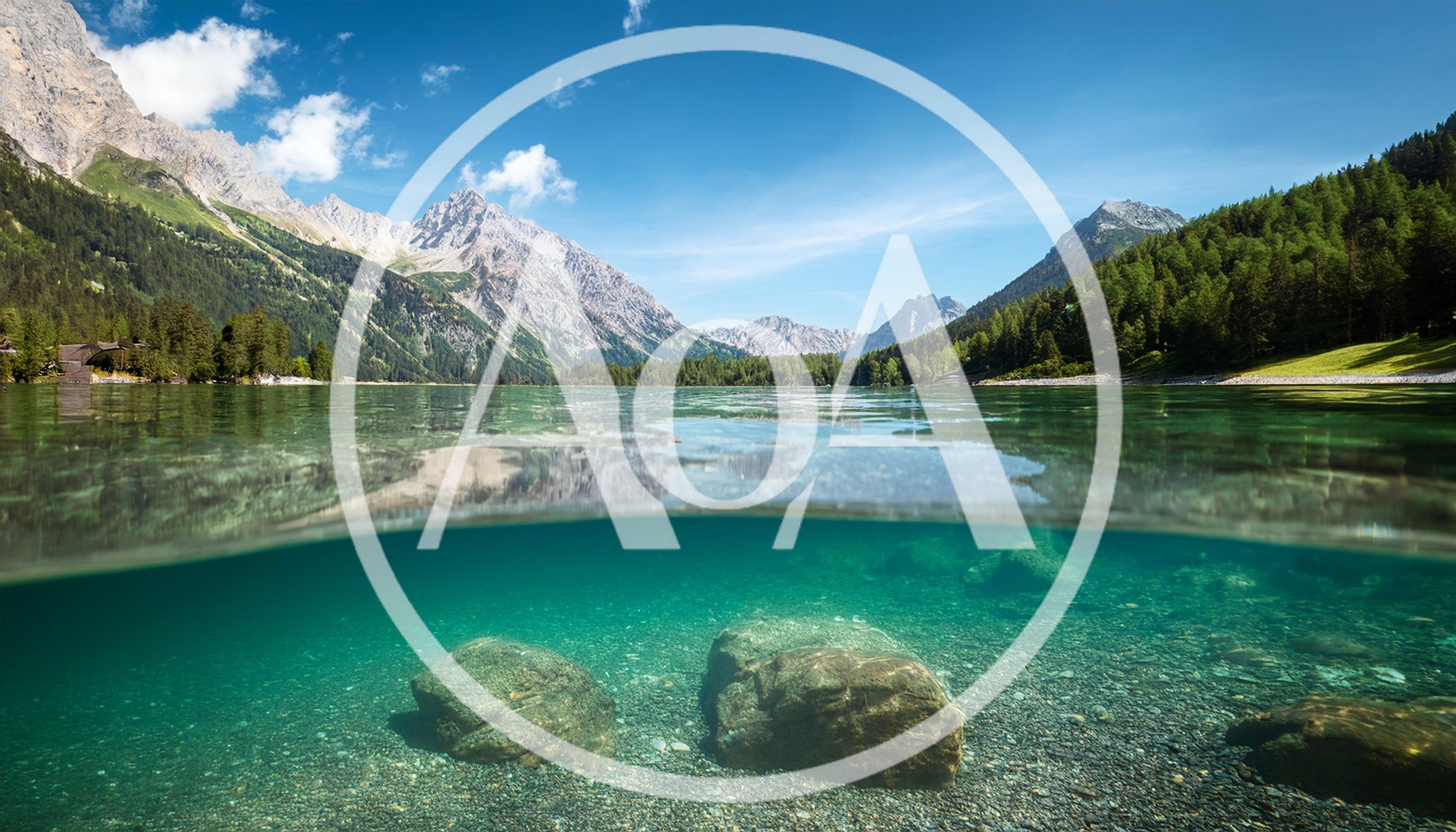 Split Level View Of Alpine Lake And Mountains
