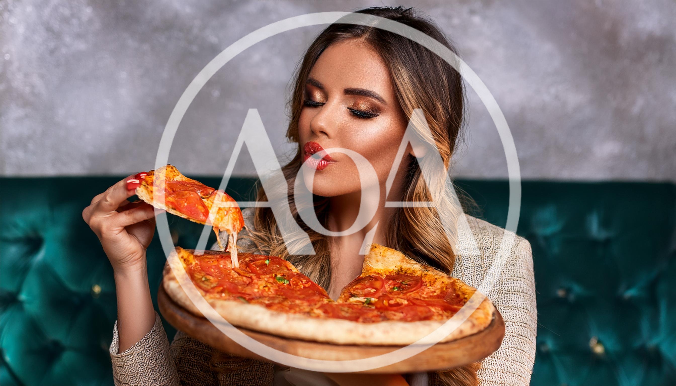 Beautiful Woman Eating Pizza In A Restaurant