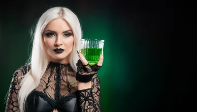 Gothic Woman Holding A Glass Of Green Potion