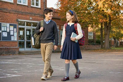 School Children Walking Together Outside School Building