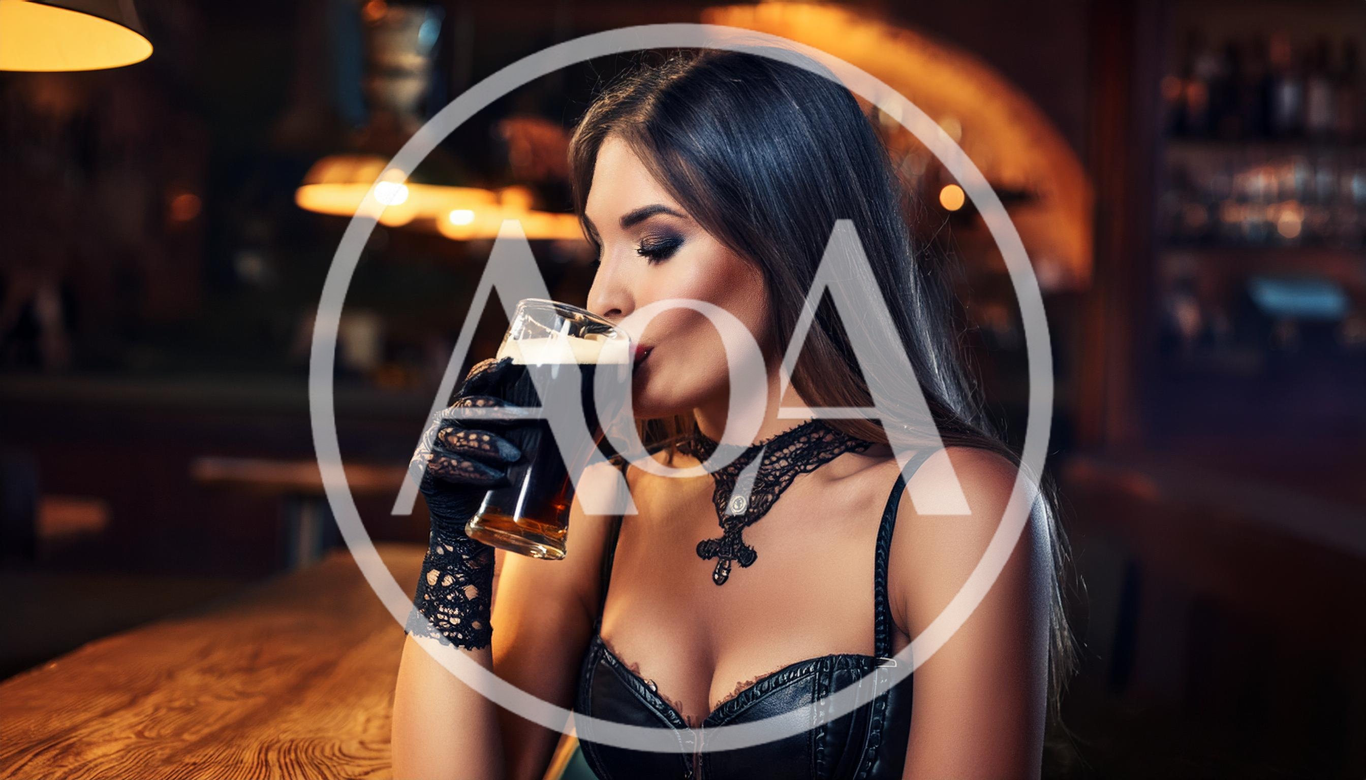 Elegant Woman Drinking Dark Beer in a Pub
