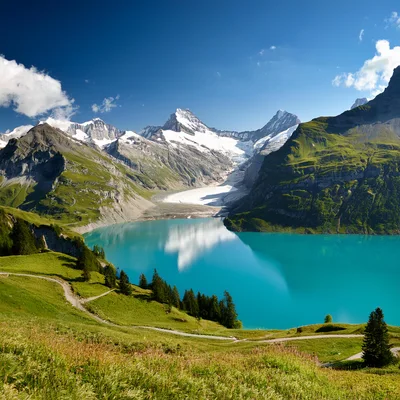 Oeschinen Lake With Glacial Mountains In The Swiss Alps