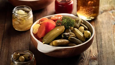 Bowl Of Pickled Vegetables On A Rustic Wooden Table