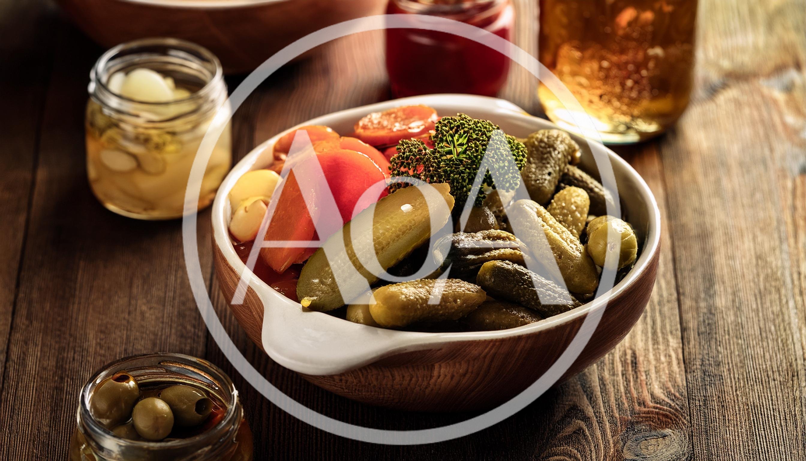 Bowl Of Pickled Vegetables On A Rustic Wooden Table