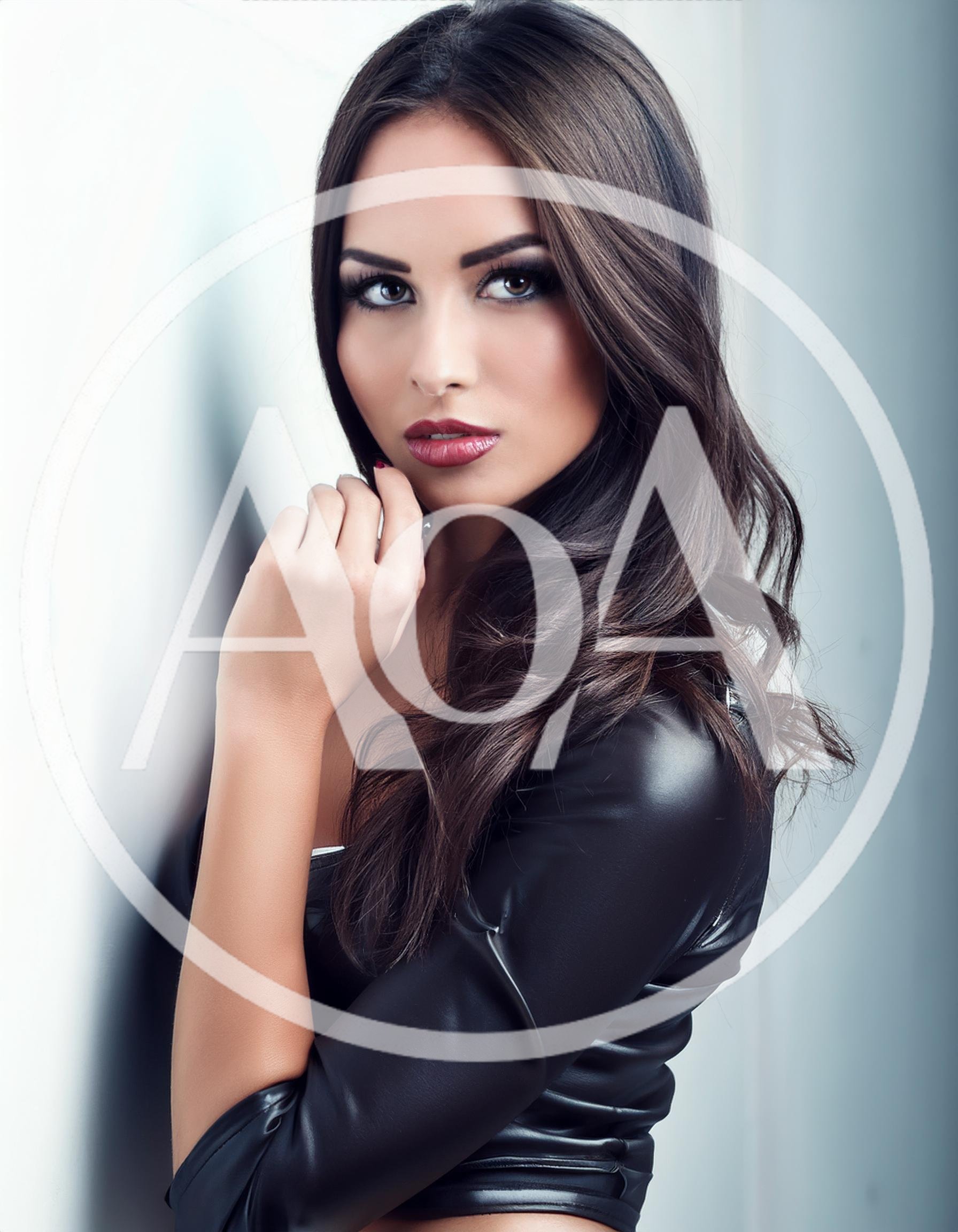 Portrait Of A Beautiful Woman In Leather Jacket