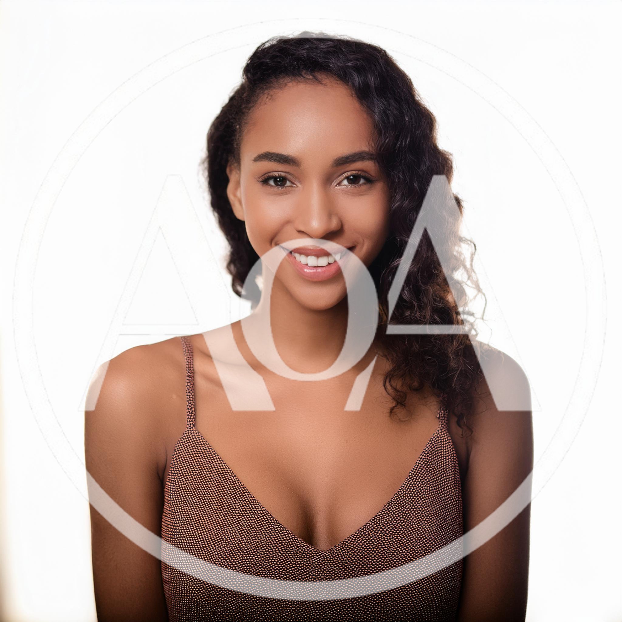 Portrait Of A Smiling Young Woman With Curly Hair