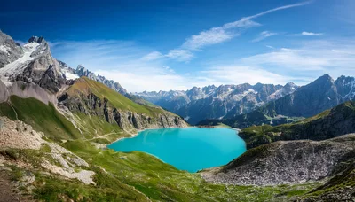 Stunning Turquoise Alpine Lake Surrounded By Jagged Mountain Peaks