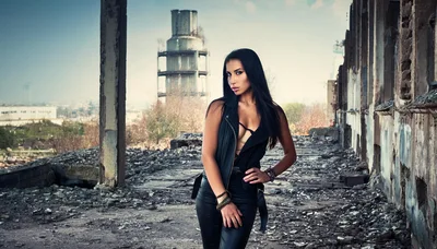Fashionable Woman Posing In An Abandoned Industrial Building