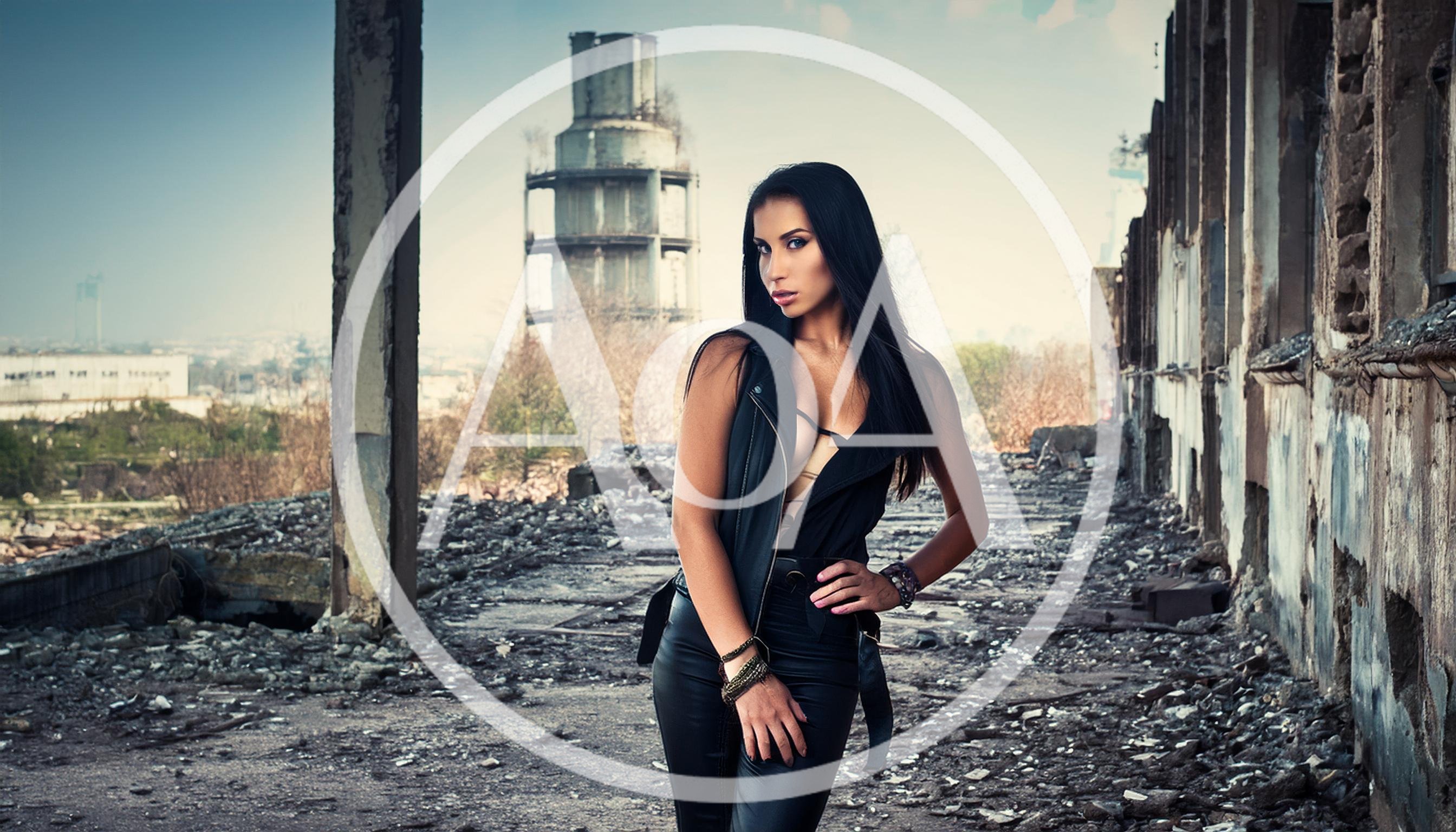 Fashionable Woman Posing In An Abandoned Industrial Building