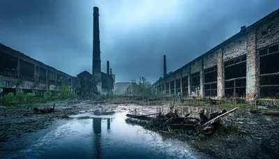 Abandoned Industrial Factory Ruins Under Rainy Sky