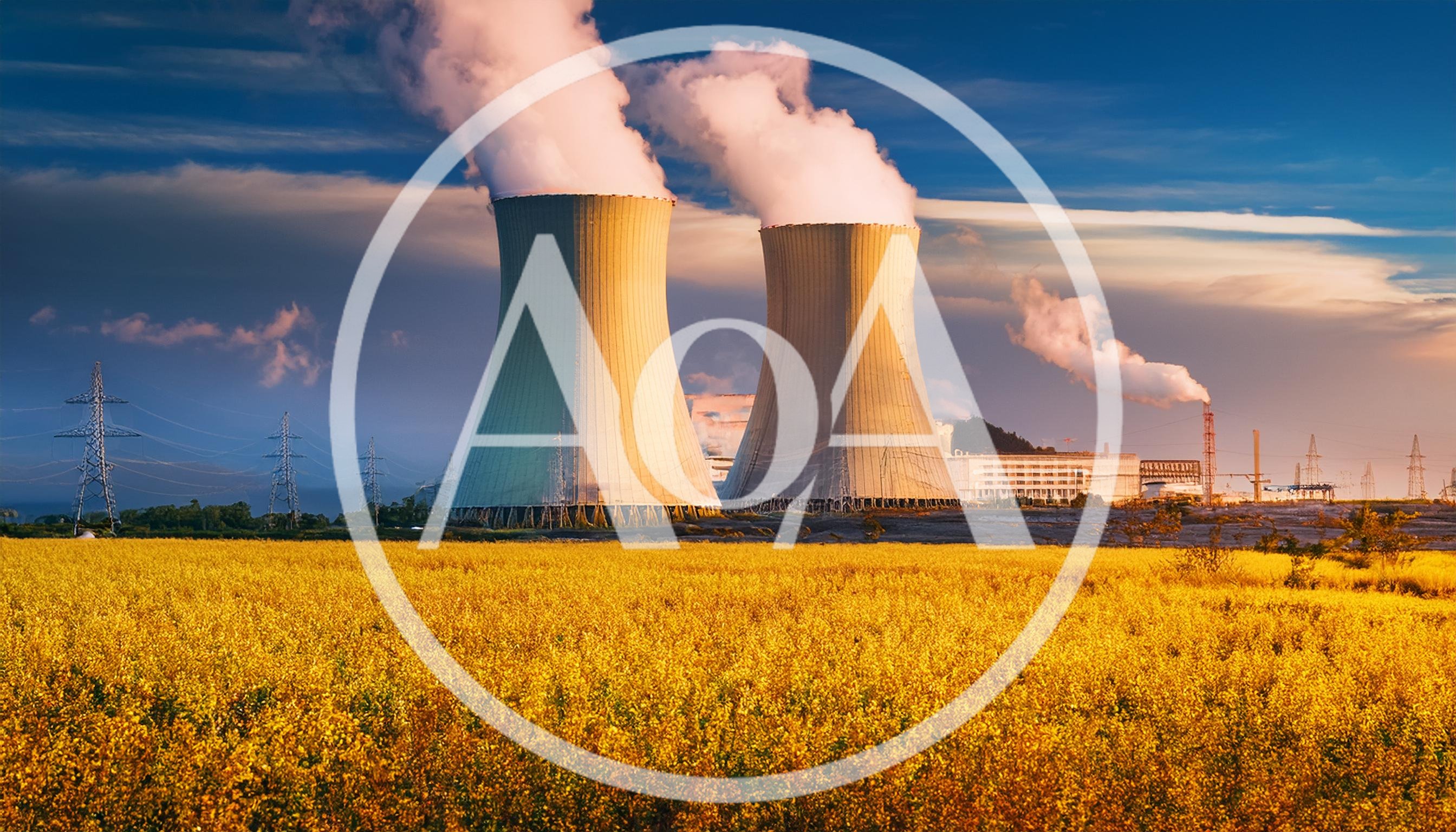 Nuclear Power Plant Cooling Towers Above Yellow Rapeseed Field