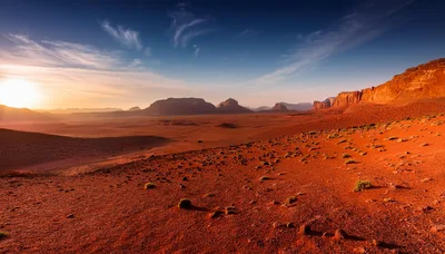 Sunrise Over The Vast Red Desert Landscape