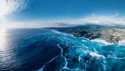 Aerial View Of Coastal Town And Ocean Waves