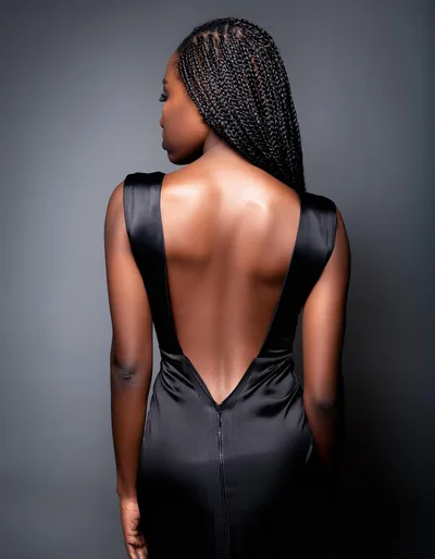 Woman In Black Backless Dress Posing