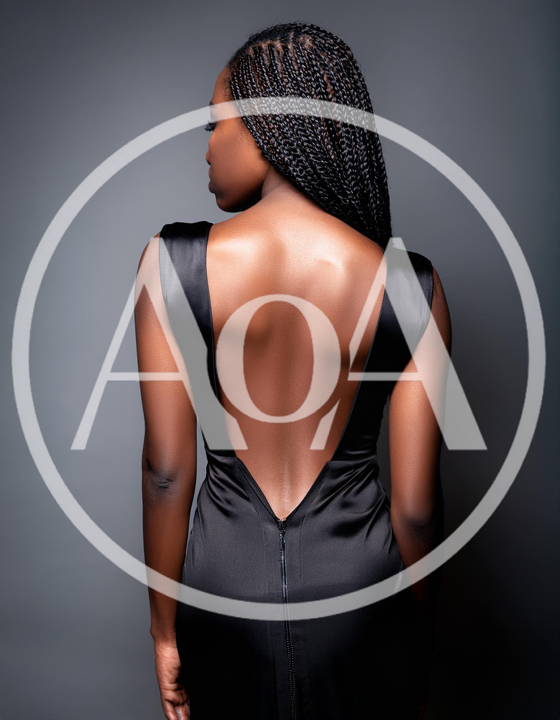 Woman In Black Backless Dress Posing