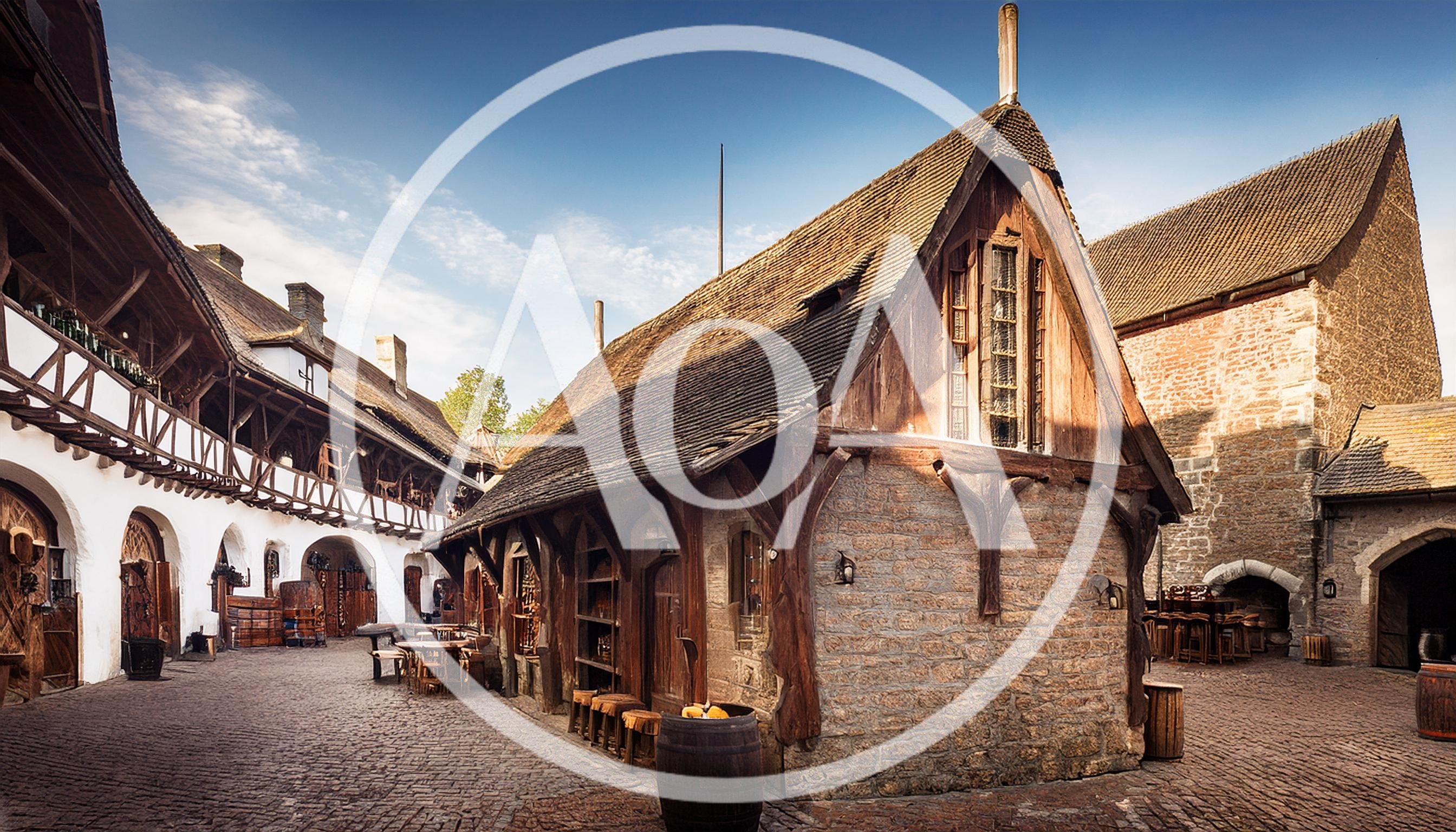 Medieval Tavern Courtyard With Stone Buildings And Wooden Architecture