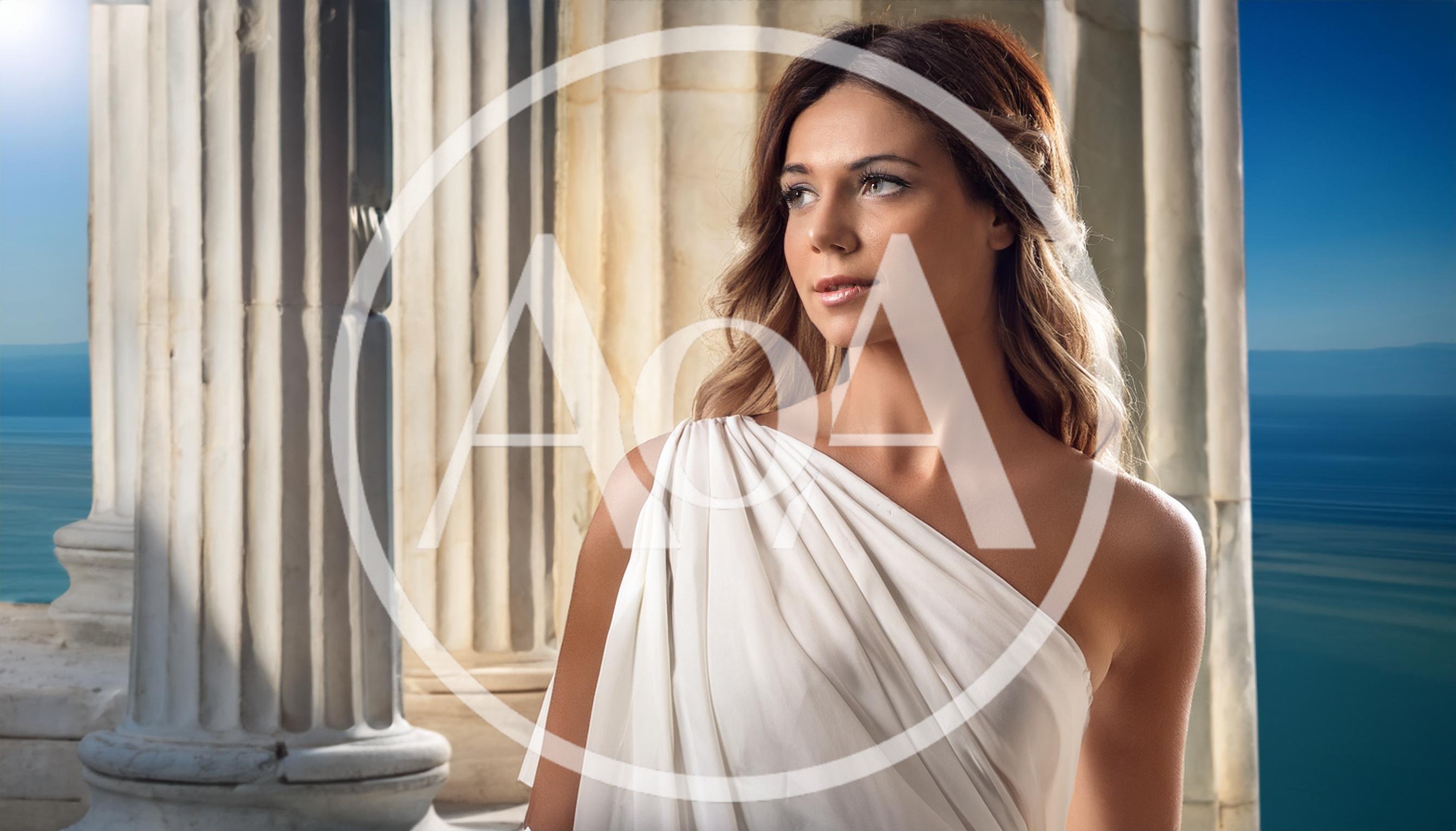 Woman In Greek Goddess Costume Standing By Marble Columns