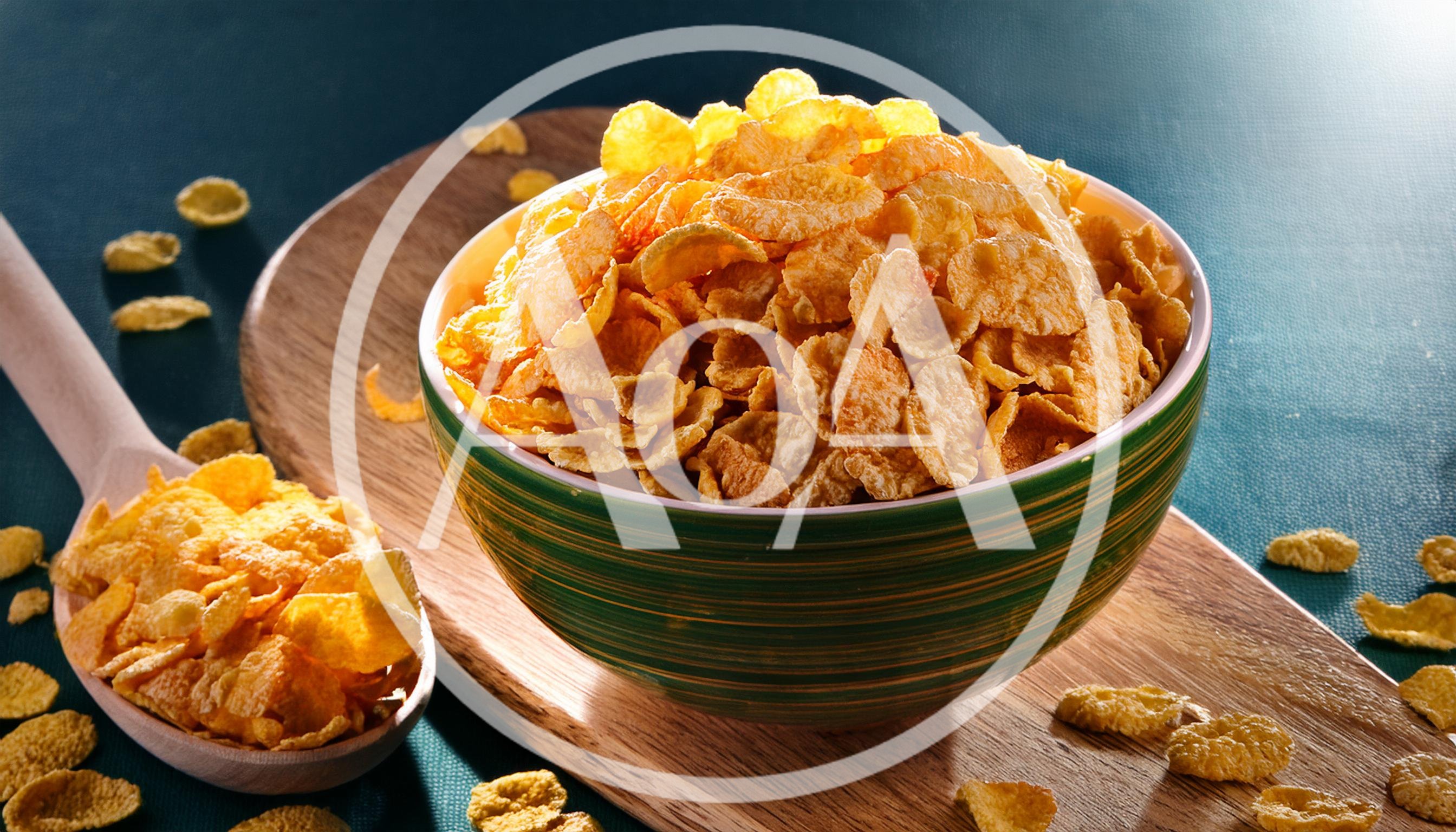 Bowl Of Crunchy Cornflakes On A Wooden Board