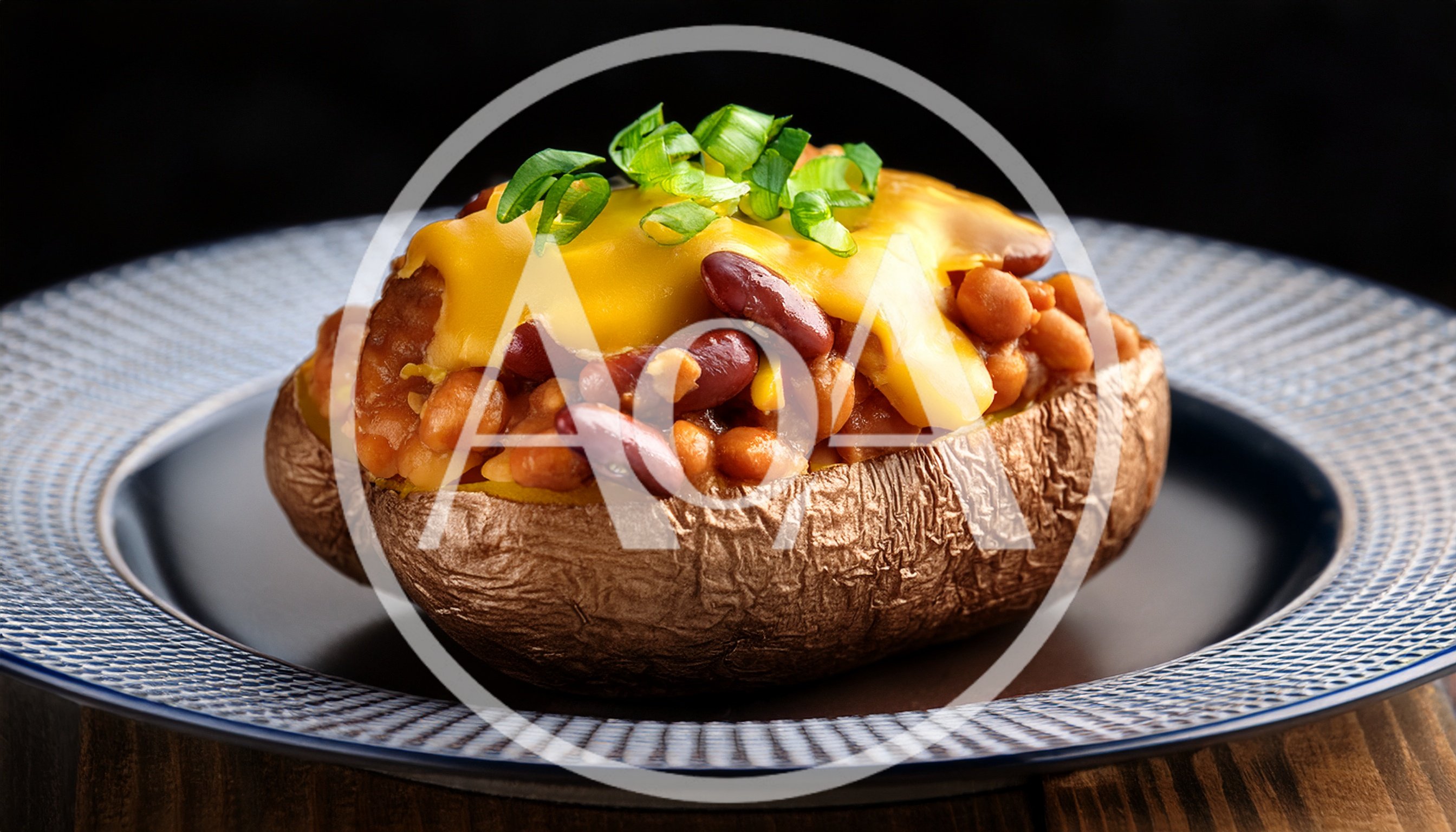 Baked Potato Topped With Chili And Melted Cheese