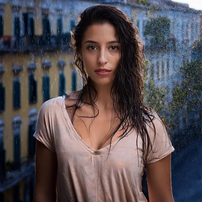 Portrait Of A Young Woman Standing In The Rain