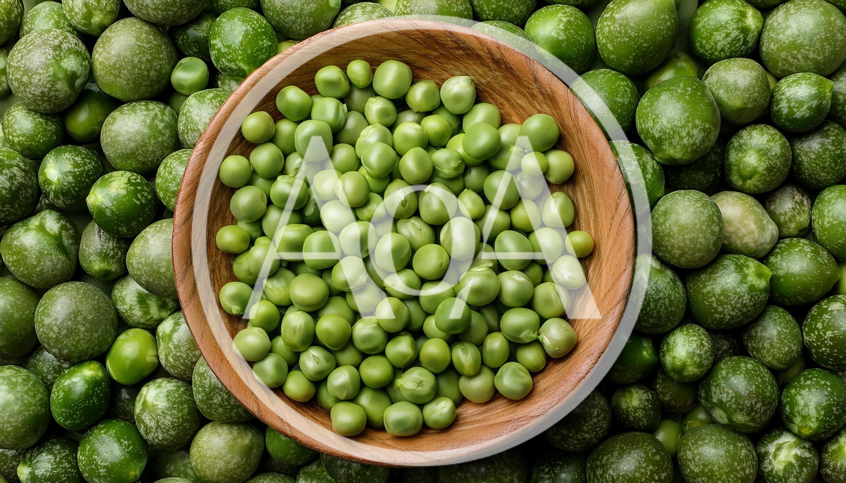Fresh Green Peas in a Wooden Bowl