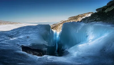 Deep Crevasse In A Glacial Ice Field