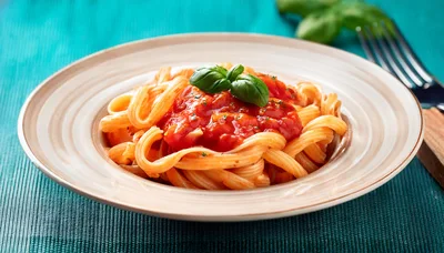 Plate Of Pasta With Tomato Sauce And Basil