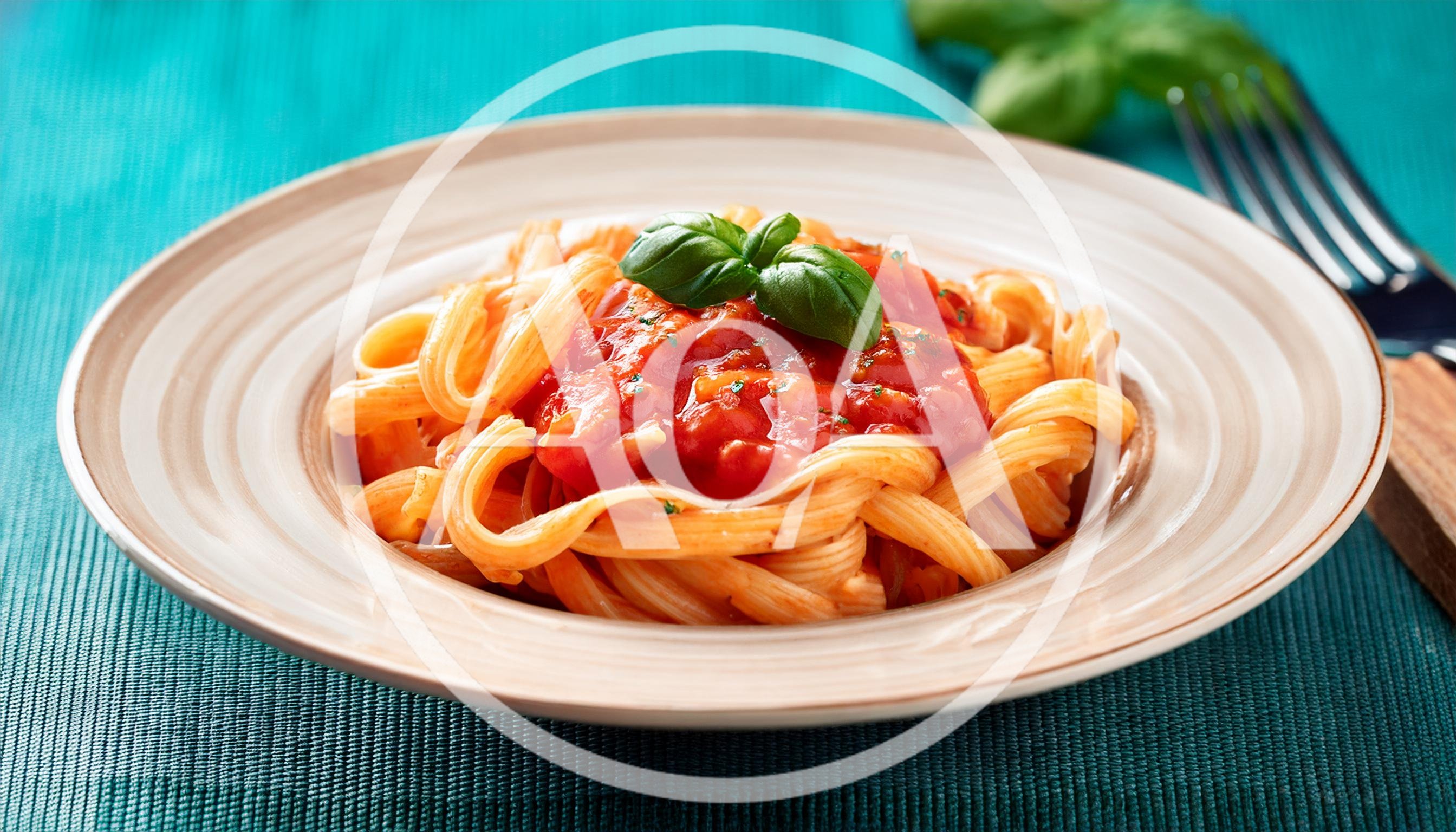 Plate Of Pasta With Tomato Sauce And Basil