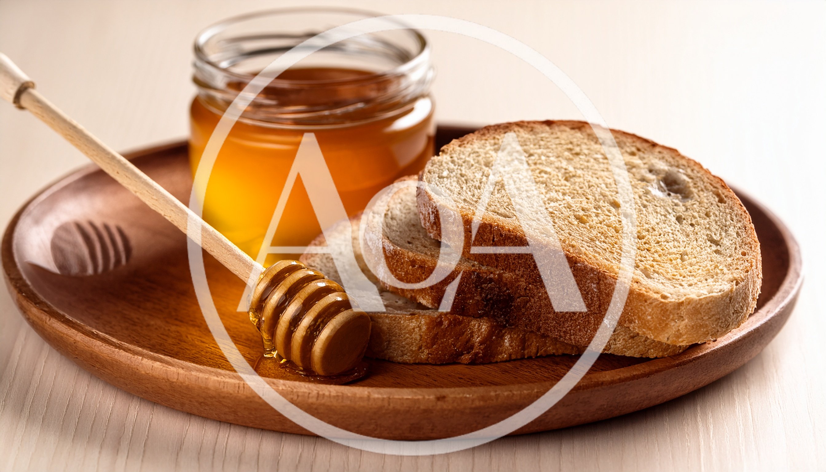 Honey Dipper With Slices Of Bread On Wooden Plate