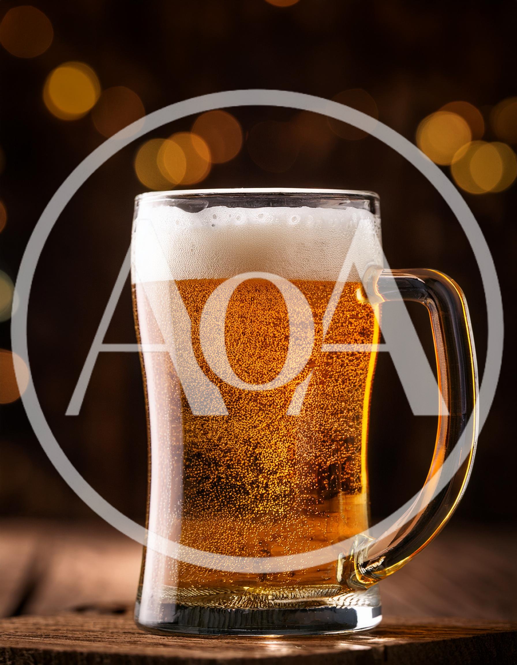 Glass Mug Of Golden Beer With Frothy Head