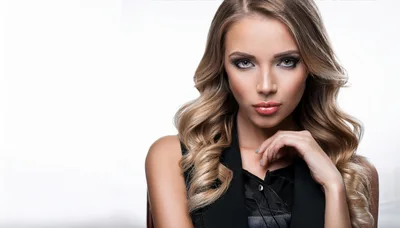 Portrait Of A Beautiful Young Woman With Wavy Hair