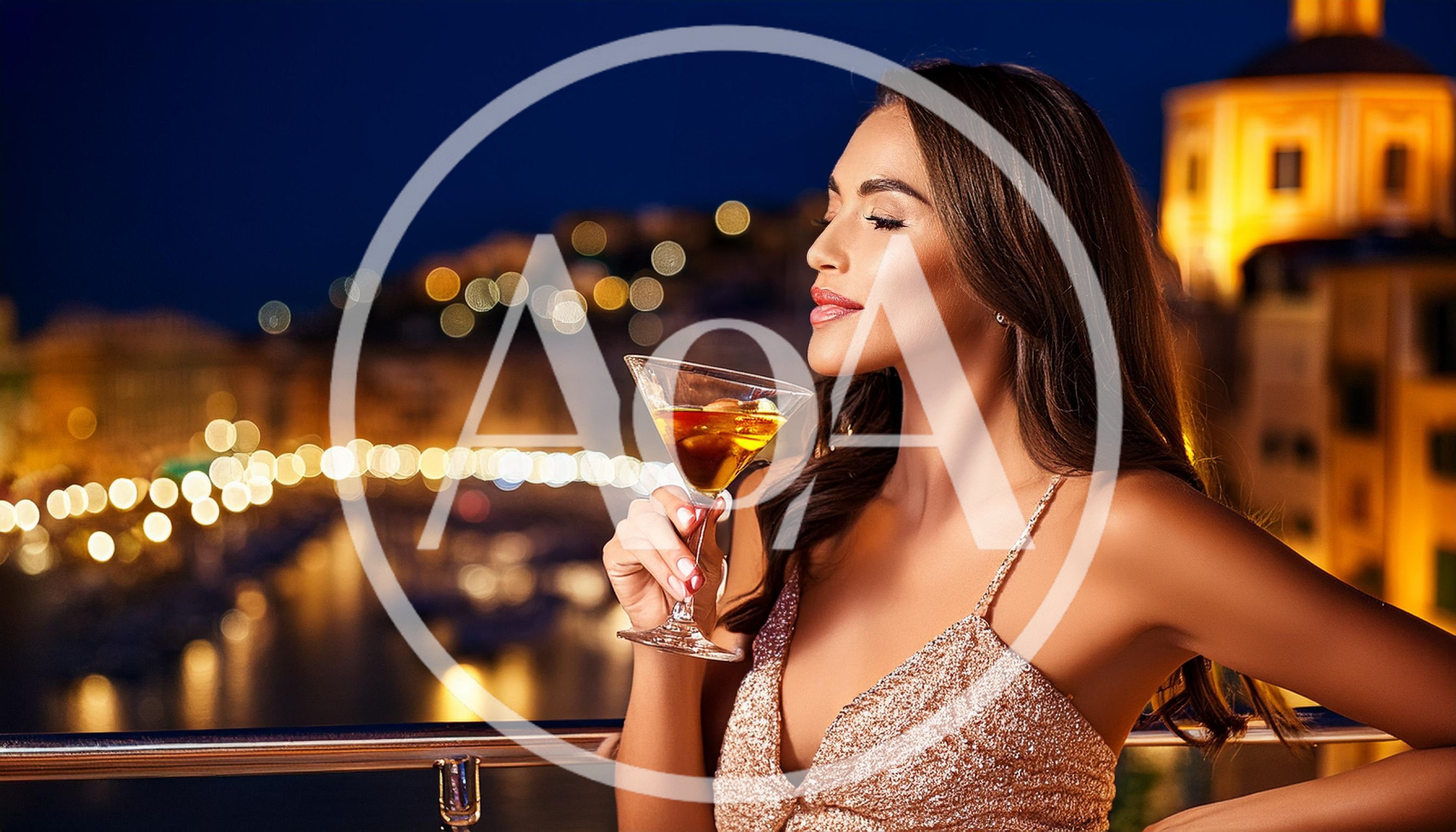 Elegant Woman Holding Martini Glass On Night Balcony