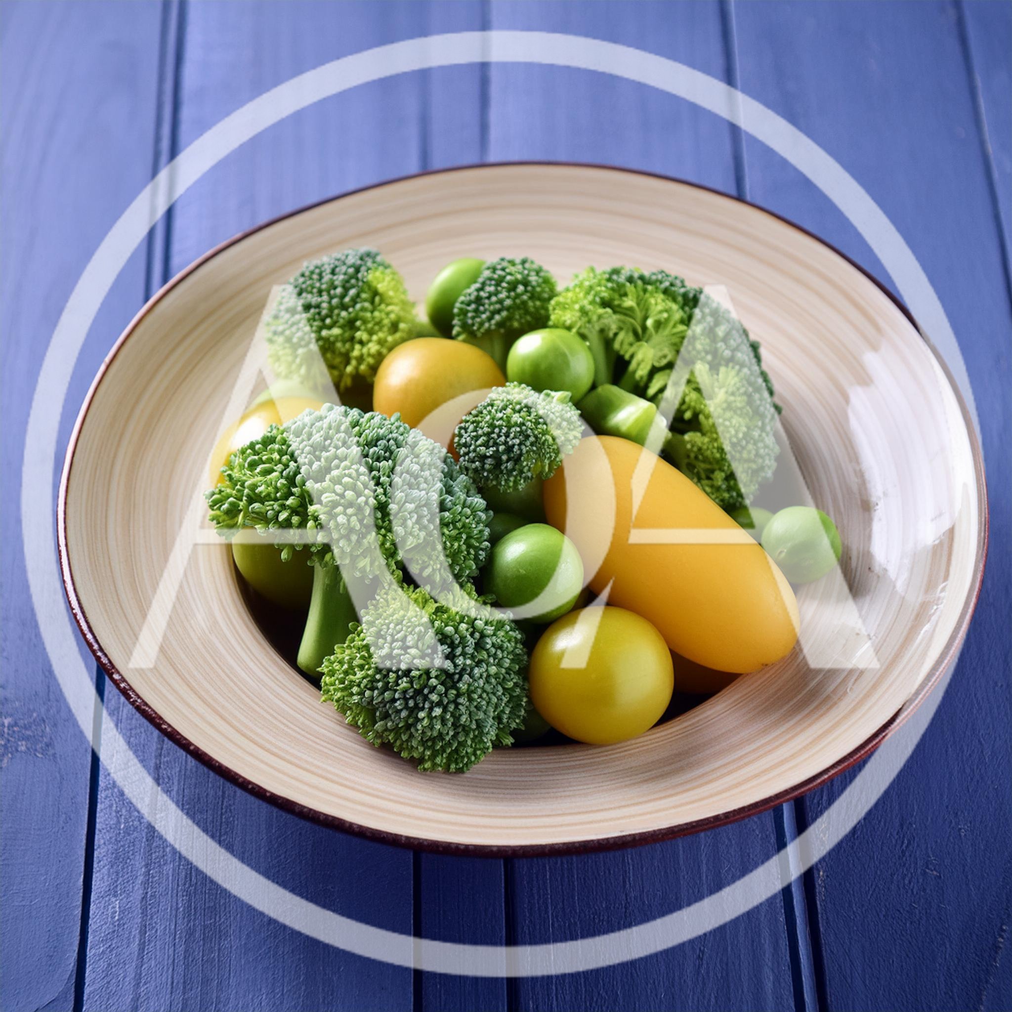 Fresh Broccoli And Yellow Tomatoes In A Ceramic Bowl