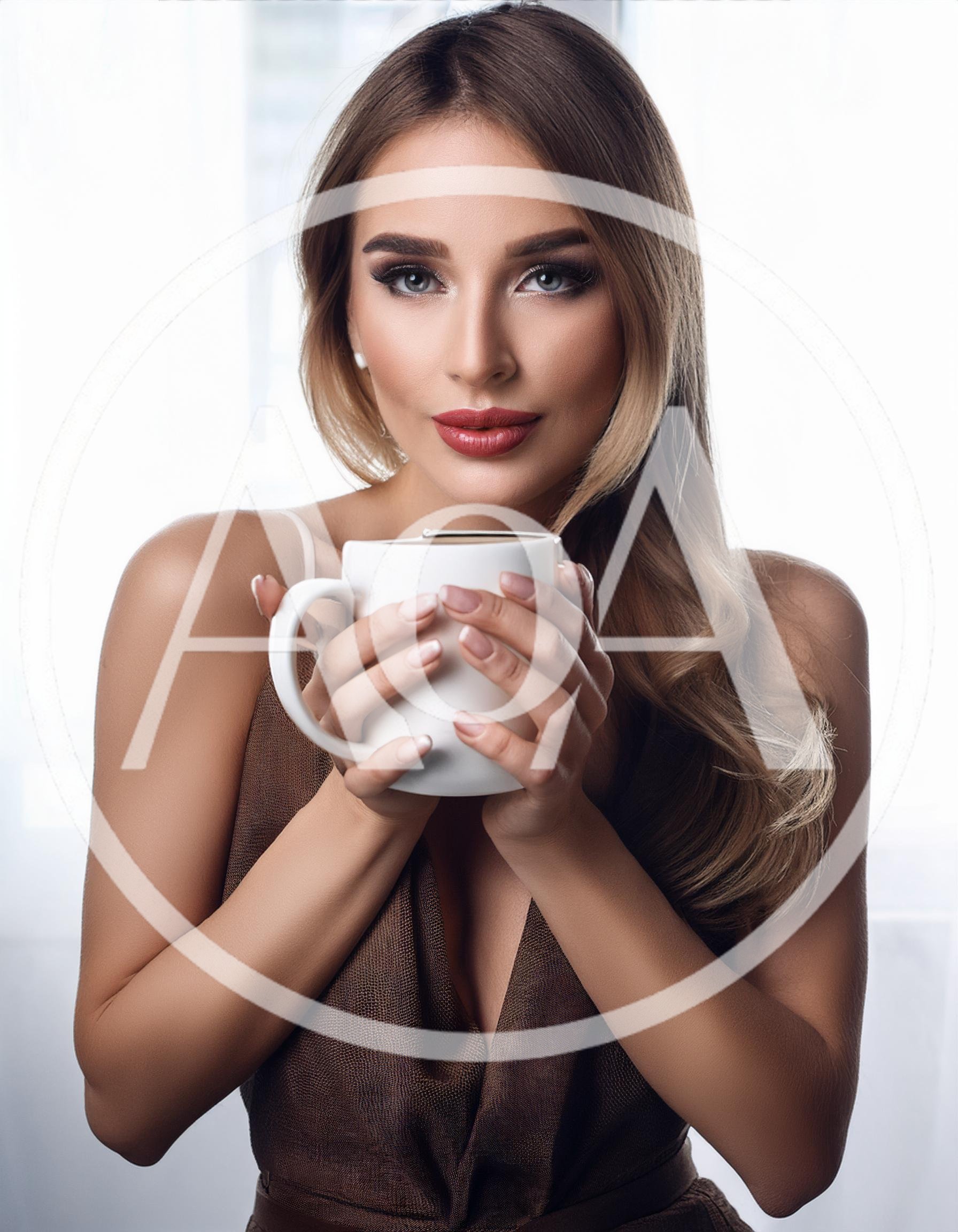 Beautiful Woman Holding A White Coffee Mug