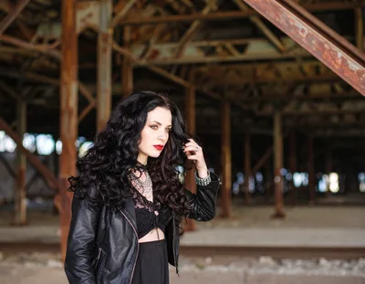 Gothic Woman Posing In Abandoned Industrial Warehouse
