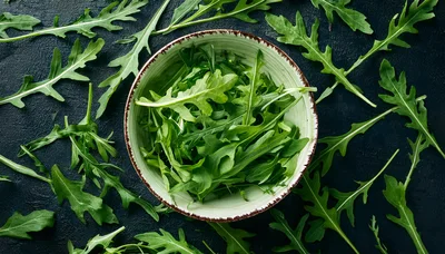 Fresh Arugula Leaves In A Ceramic Bowl