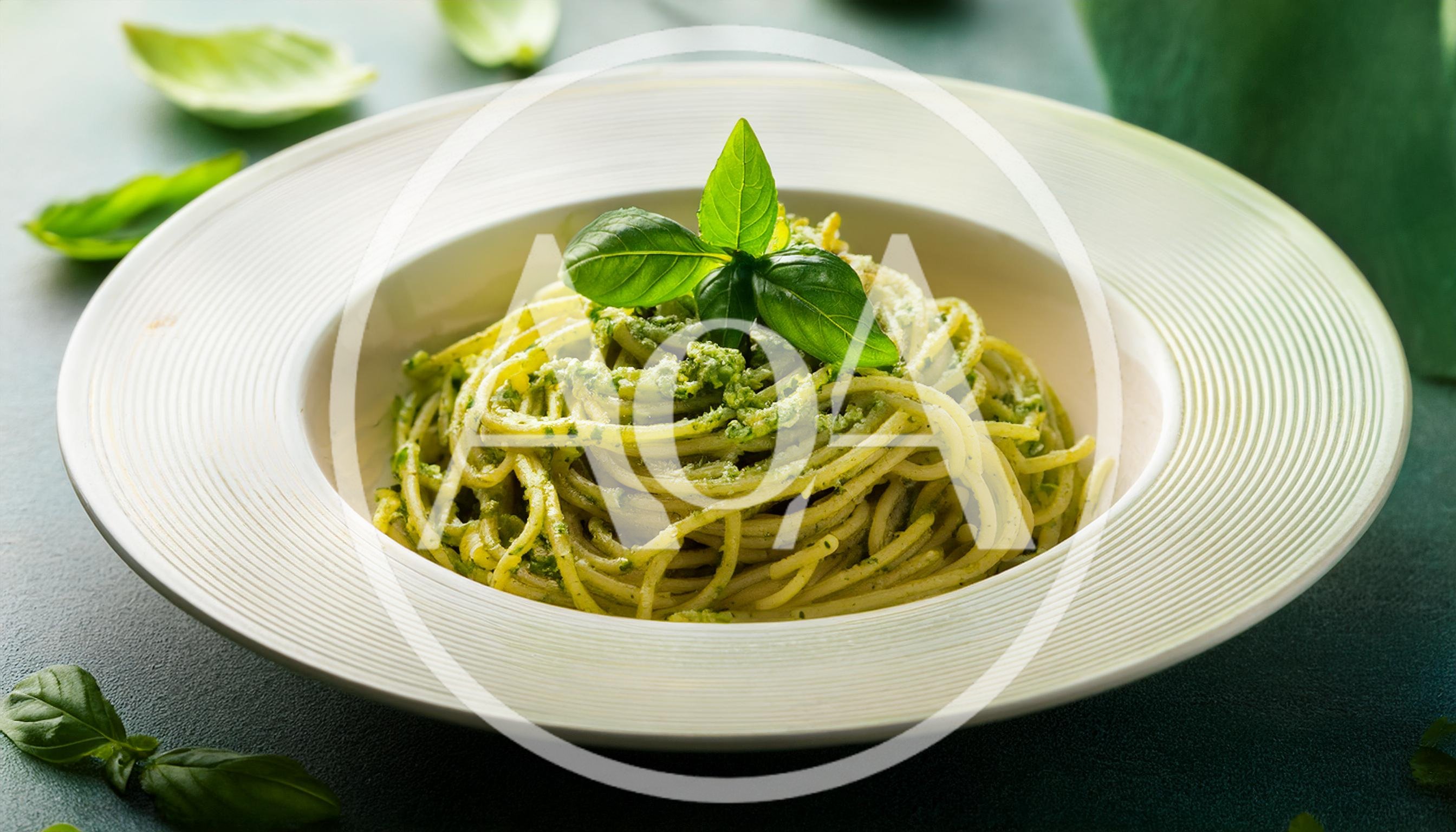 Spaghetti With Pesto Sauce In A White Bowl
