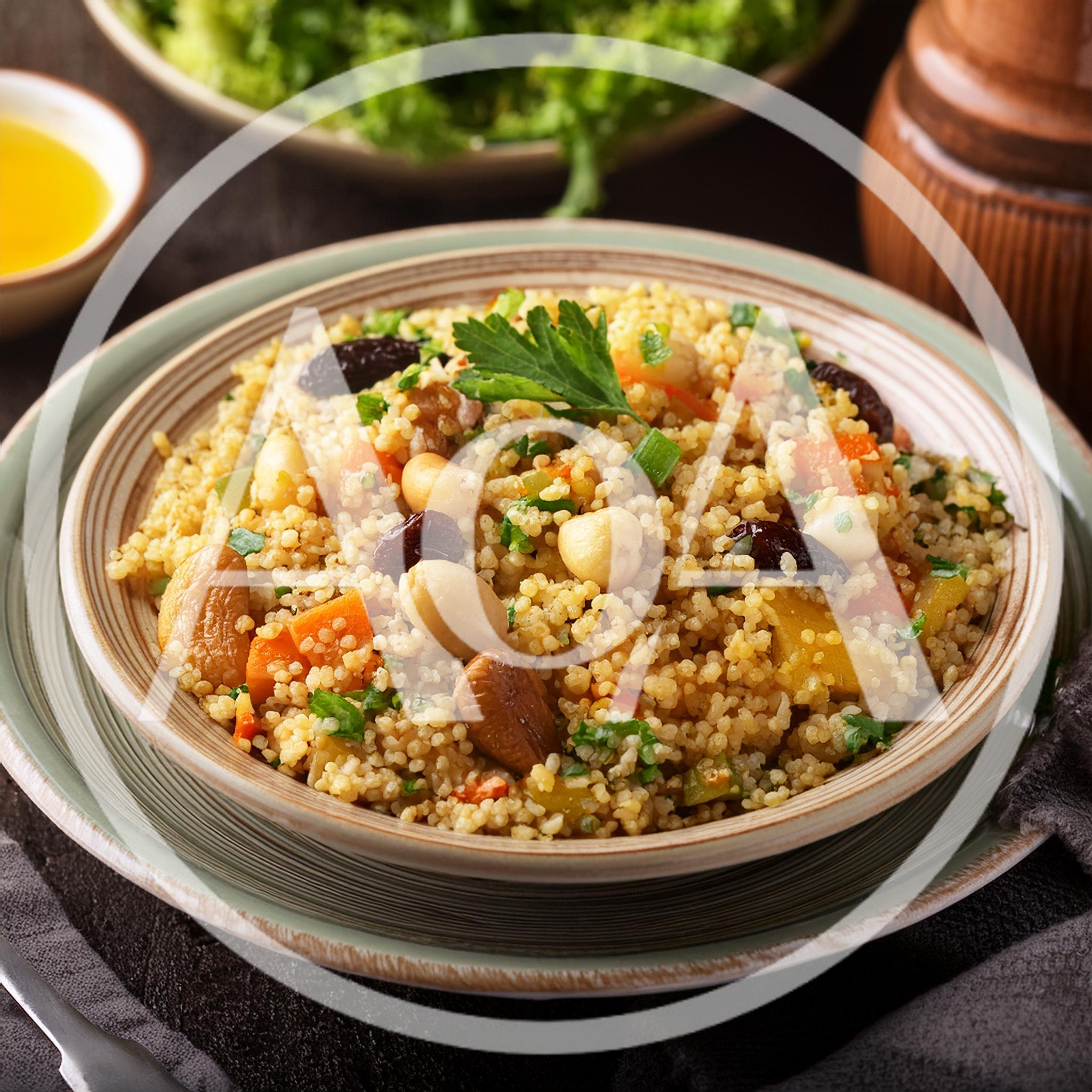 Bowl Of Healthy Couscous Salad With Nuts And Vegetables