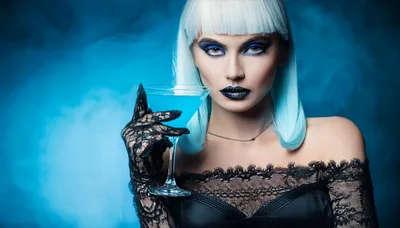 Fashionable Woman With Blue Hair Holding A Martini Glass