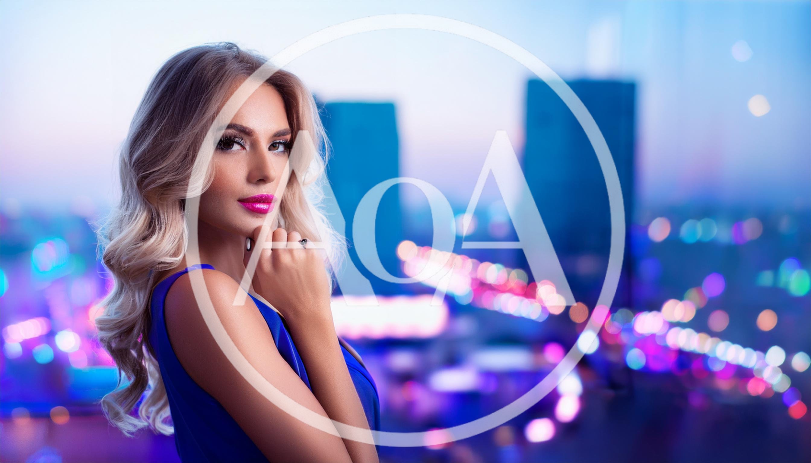 Glamorous Blonde Woman Posing Against City Night Lights