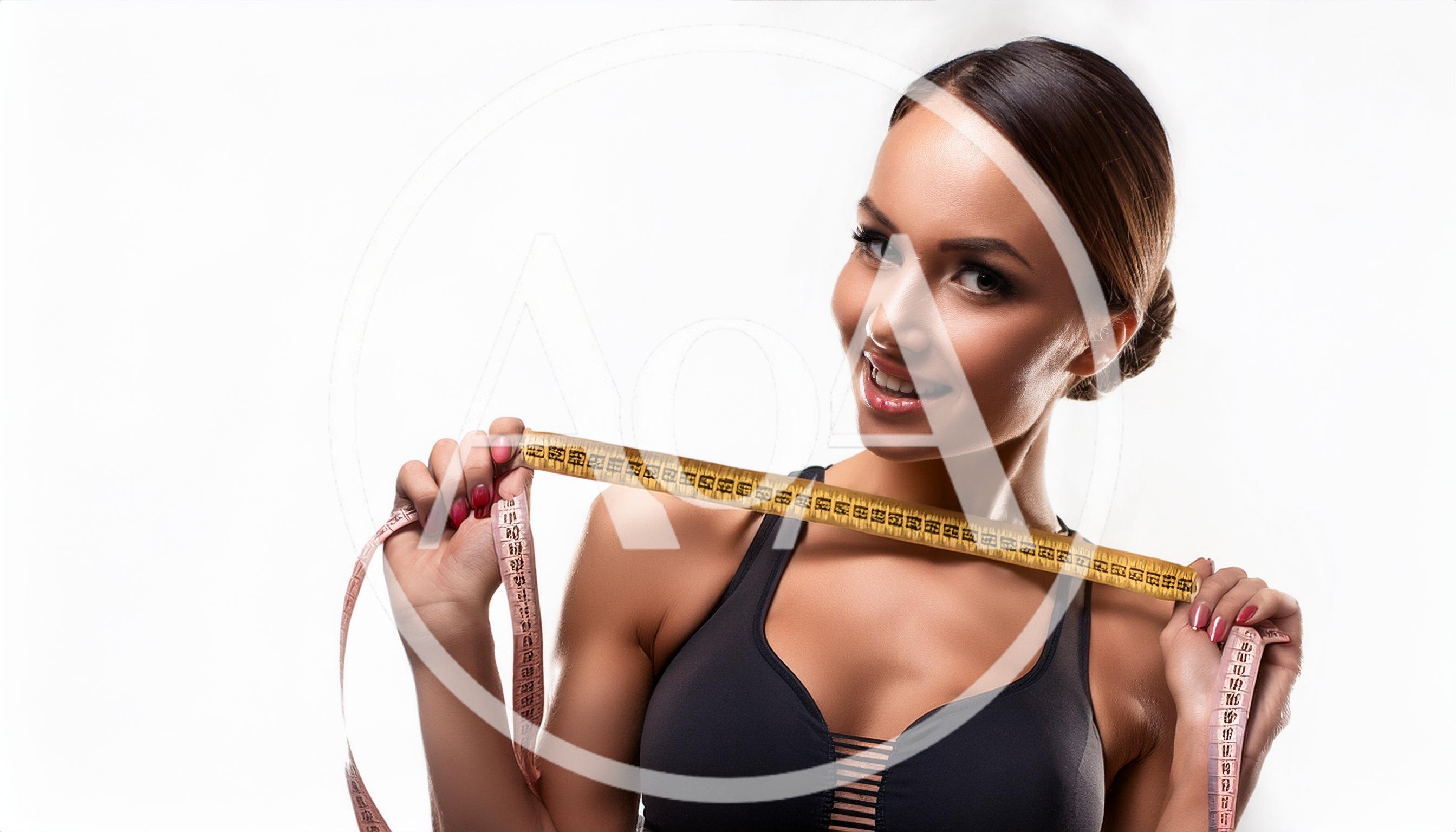 Fit Woman Holding Measuring Tape Around Her Shoulders