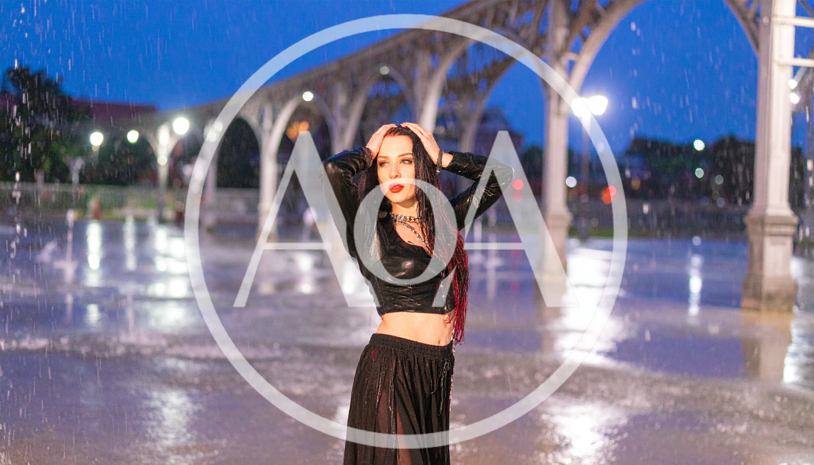 Woman Posing In Rain Under Illuminated Arches
