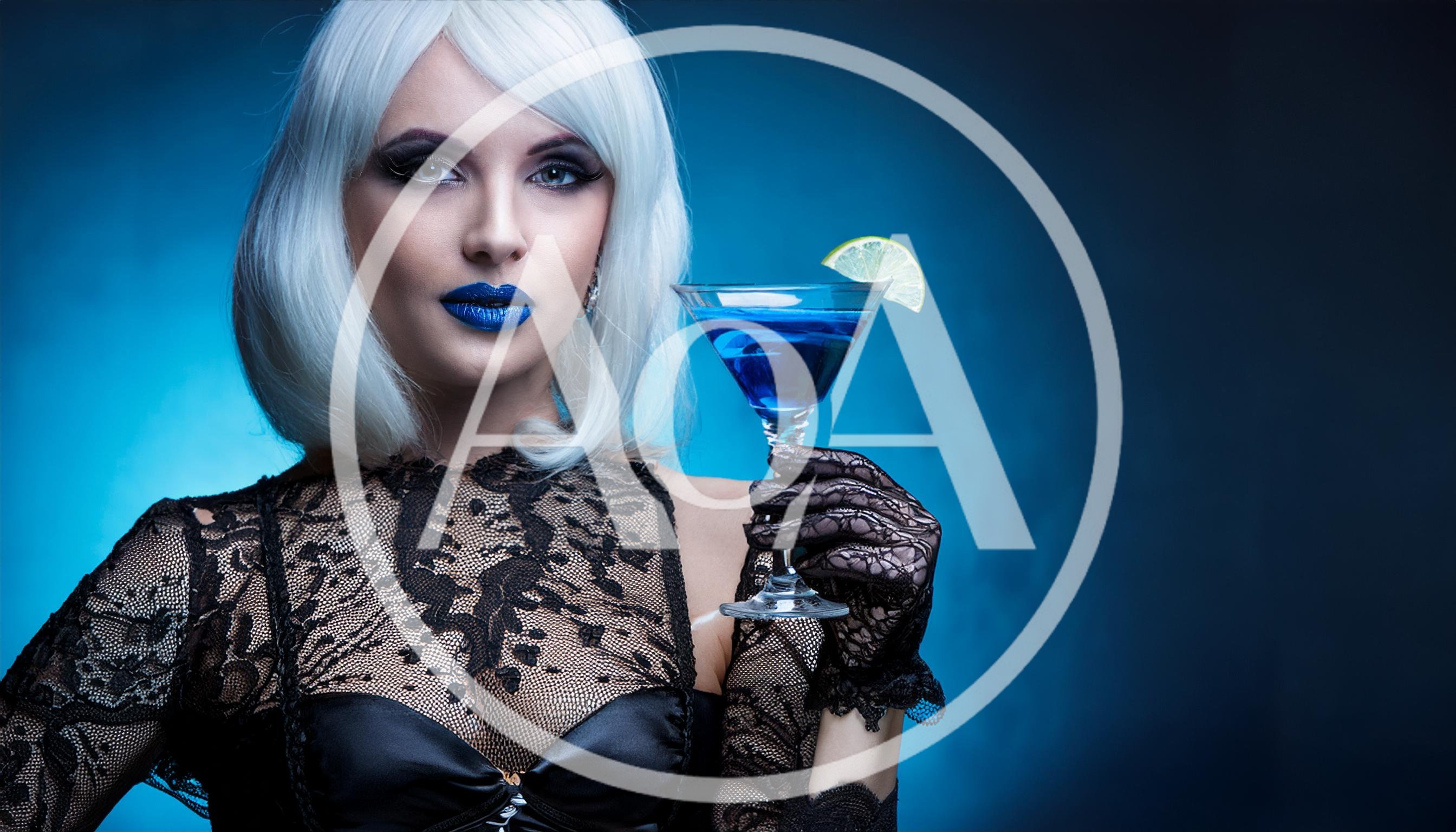 Woman With White Hair Holding A Blue Cocktail